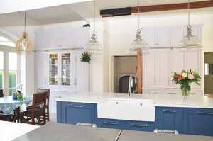 Unfitted designed kitchen with blue cupboards