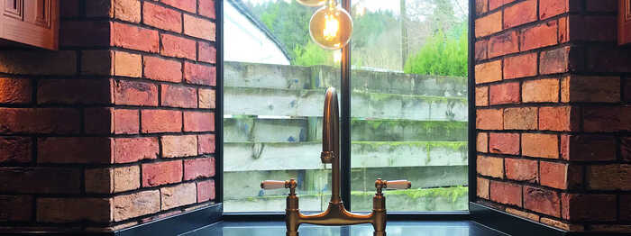 brass taps and pendant lights