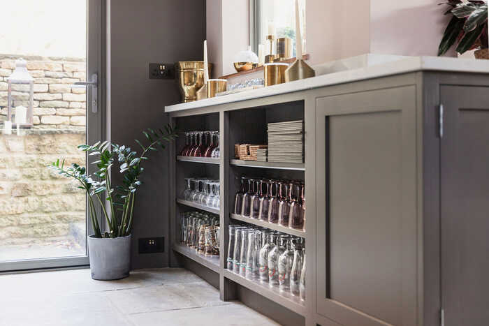 dark grey storage cabinets with tile flooring